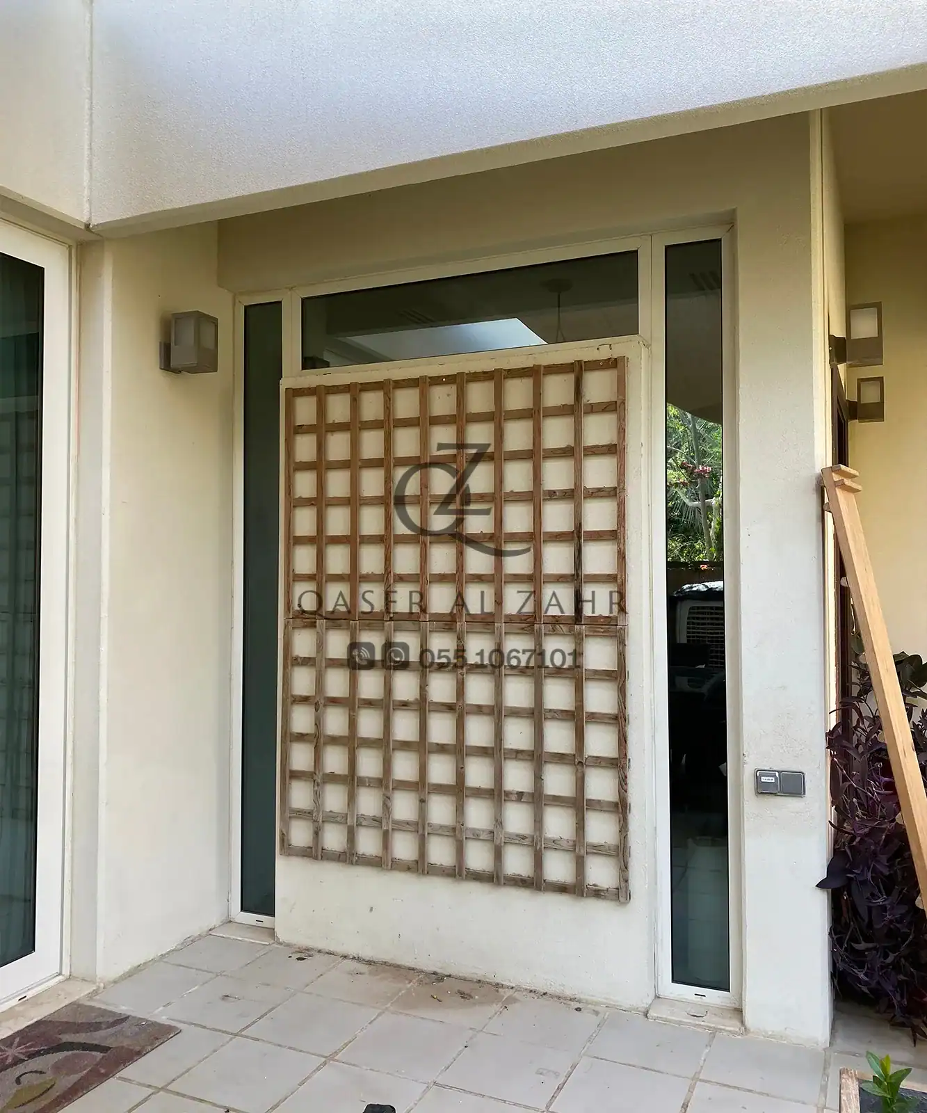 Wooden Trellis Frame Installation in Progress for Glass Wall